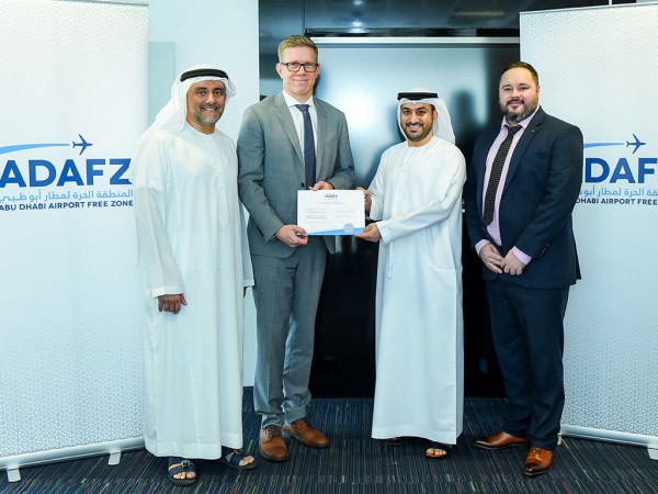 Göran Eriksson, Managing Director of GAC Abu Dhabi (2nd from left) receives the free zone registration certificate from Adel Al Taheri, Acting GM of ADAFZ. Also present: (From left) Sultan Al Amiri, VP – Accounts of ADAFZ and (far right) Richard Rees, Business Manager – Logistics of GAC Abu Dhabi
