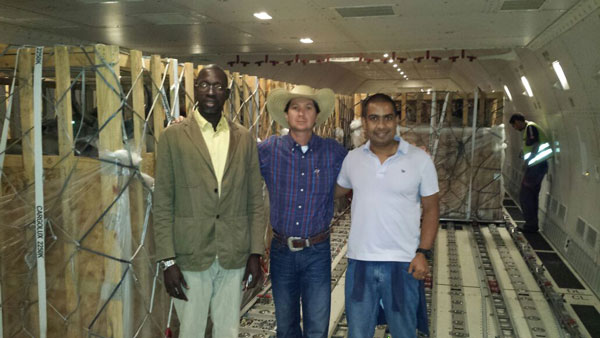 On the right, AIB Internacional CEO Cristiano Lima onboard 747-700 aircraft during the the preparation for the transport of live cattle animals to Senegal, Africa