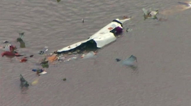 This image taken from video provided by KRIV FOX 26 shows the scene of a cargo plane crash on Feb. 23 in Trinity Bay, just north of Galveston Bay and the Gulf of Mexico in Texas. (KRIV FOX 26 via AP)