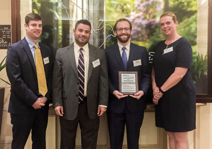 BDP International employees pose with the APICS Company of the Year 2017 Award from the APICS Philadelphia Area Network (PAN) Chapter. Pictured left to right are Matthew White, Director of Human Resources for North America; Mark Trasatti, Director of Talent Acquisition; Josh Gordon, Talent Acquisition Specialist; and Marcia Lyssy, Chief Human Resources Officer. 