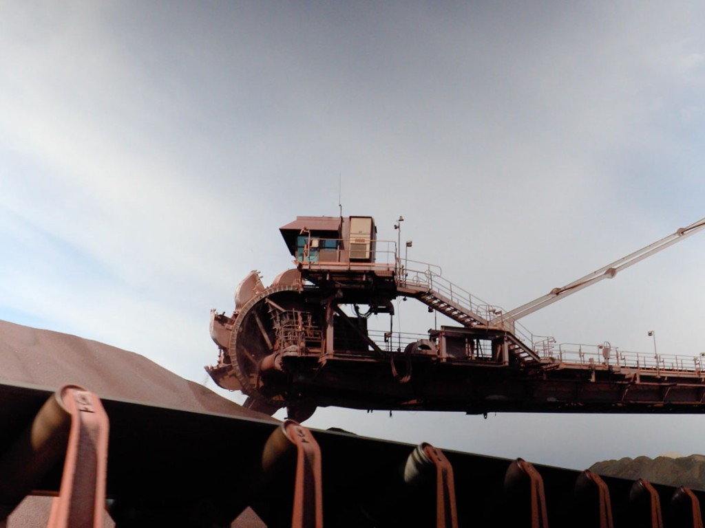 A stacker reclaimer in operation collecting iron ore from a stockpile in Burns Harbor, Indiana.