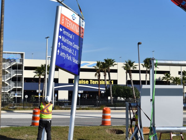 Construction crews begin installing new signs near Cruise Terminal 1