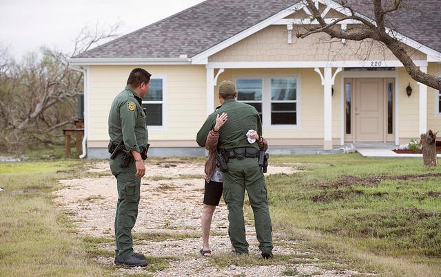 A grateful disaster survivor hugs a U.S. Border Patrol agent. U.S. Border Patrol agents were part of U.S. Coast Guard emergency operation centers identifying disaster survivors in need of assistance.