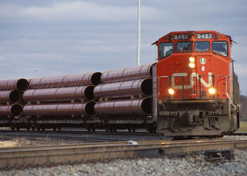 CN Rail transporting metal pipes