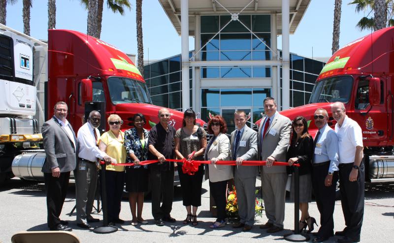 Representatives of C.R. England are joined by local city and area government officials at the opening of the new England facility in Colton, CA, June 11, 2014 (PRNewsFoto/C.R. England, Inc.)