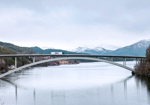 A DSV truck and trailer on its way over Skodje bridge in Norway