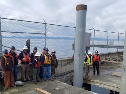  Port Project Manager Steve Hager and Advanced American Construction’s crew celebrate final pile installation on Feb. 19, 2019.