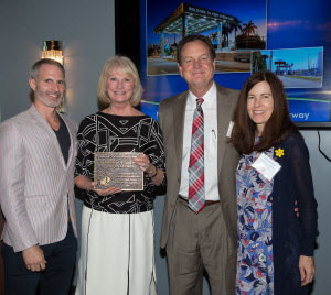 Peg Buchan, second from left, receives the Community Appearance Award for Broward County's Port Everglades from the City of Fort Lauderdale. She is joined by, from left: David Bowles, Vice Chair Community Appearance Board, City Commissioner Romney Rogers, and Leslie Fordham, Arts Administrator for Broward County's Cultural Division. 
