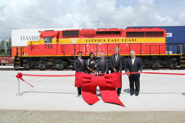 Opening the Florida East Coast Railway’s (FEC) new freight facility at Port Everglades are, from left: Florida Rep. George Moraitis, Jr., Broward County Mayor Barbara Sharief, FEC President and CEO Jim Hertwig, Port Everglades Chief Executive & Port Director Steven Cernak, and Florida Department of Transportation Assistant Secretary for Intermodal Systems Development Transportation Richard Biter. 
