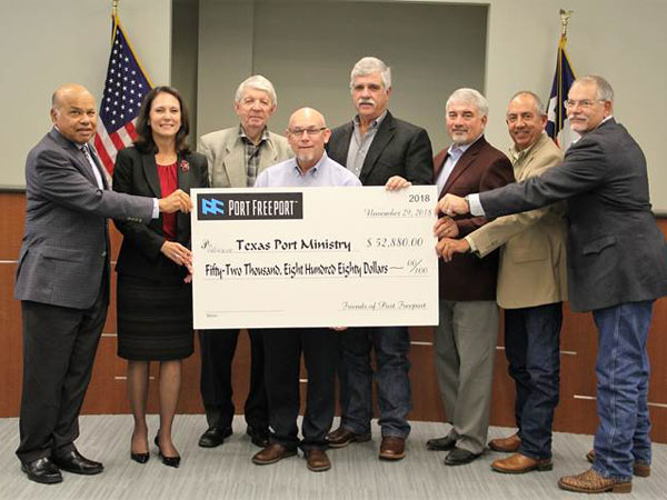 Port Commission presents check to Bobby Fuller, Director of Texas Port Ministry.