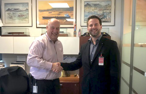 Phil Davies, left, General Manager of Marine Transportation for Chevron Shipping Company congratulates Lars Hardeland, right, Managing Director of GAC’s Global Hub Services on the company securing the global oil and LNG shipping contract.