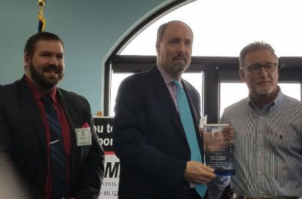Port of Indiana-Burns Harbor Port Director Ian Hirt (center) accepts the 2019 PCA Industrial Award from the Northwest Indiana Partners for Clean Air (PCA).