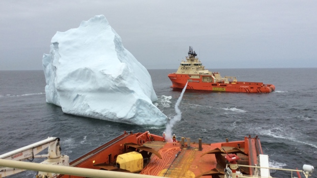 moments after a rope line was shot between two vessels so they could move in tandem to guide the iceberg away. (J.D. Irving Ltd.) 