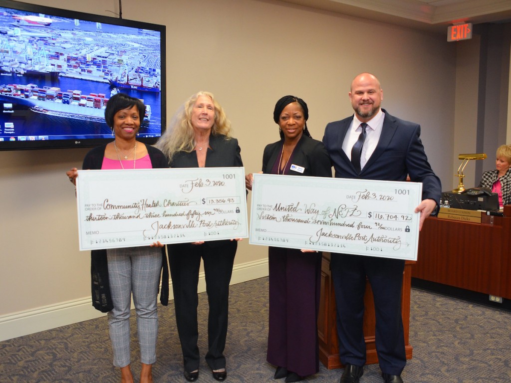 JAXPORT Manager of Procurement Services Retta Rogers (L) and Risk Manager Chris Crouch (R) present donations to Community Health Charities and the United Way of Northeast Florida.