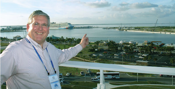 Port Canaveral CEO John E. Walsh points to area where he hopes to develop container terminal facilities along a 55-foot-deep harbor. (Photo by Paul Scott Abbott, AJOT) 