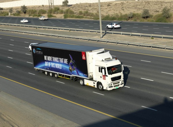 A specially branded Emirates SkyCargo truck transported KhalifaSat from MBRSC's facilities to Emirates SkyCentral DWC with a police escort