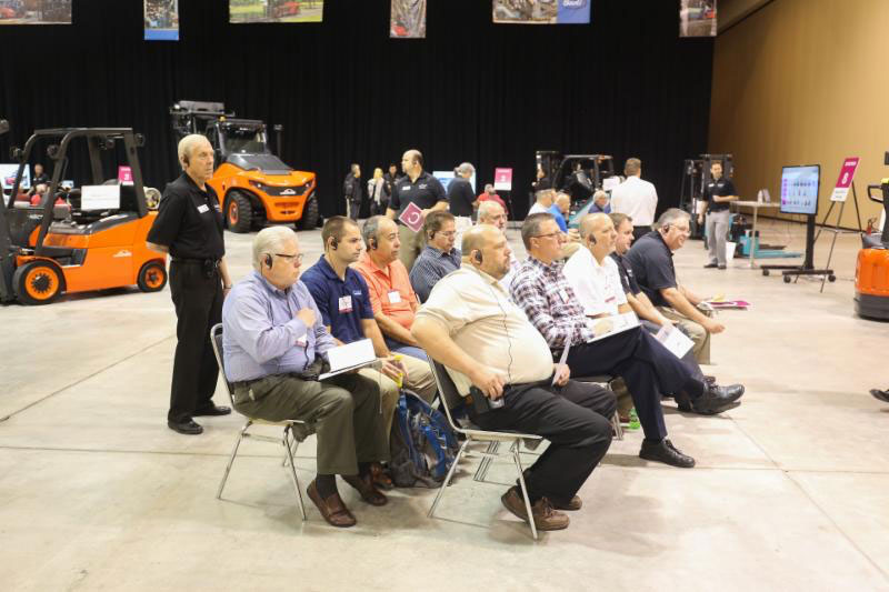KION North America dealers listening to a presentation about the company's new product development