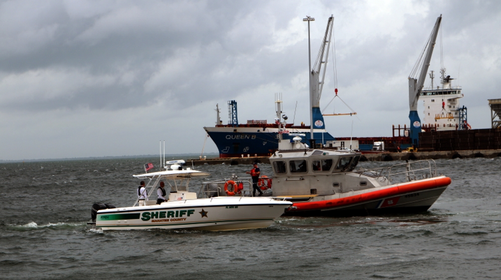 Boats of the Manatee County Sheriff’s Office and U.S. Coast Guard return from laying a wreath in the Port Manatee ship basin, closing the Port Manatee Propeller Club’s National Maritime Day ceremonies.