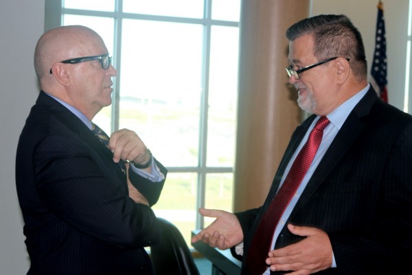 Leszek Ladowski, president of the Polish-American Chamber of Commerce of Florida and the Americas, right, discusses trade opportunities with Port Manatee Executive Director Carlos Buqueras.