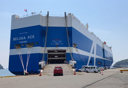 Loading cars on the Beluga Ace at the Port of Hiroshima, and loaded Mazda cars in the hold of the vessel