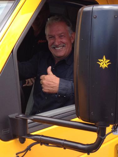 Most recent investor Gary Magness gives a thumbs-up while driving the Trans Tech Bus SST-e all-electric school bus, powered by Motiv Power Systems. (PRNewsFoto/Motiv Power Systems)