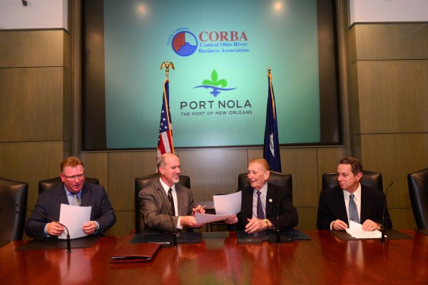 L-R: Robert Carlisle, president of Carlisle & Bray Enterprises, Eric Thomas, Executive Director of the Central Ohio River Business Association (CORBA), Gary LaGrange, President and CEO of the Port of New Orleans, and Robert Landry, Chief Commercial Officer of the Port of New Orleans, sign a Memorandum of Understanding between the Port and CORBA to jointly market and share information in an effort to build commerce between the two regions.