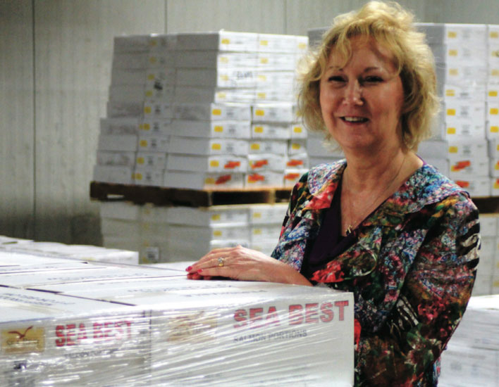Paige Savitz, longtime director of import operations at Jacksonville, Fla.-based Beaver Street Fisheries Inc., takes a hands-on approach with shipments of Sea Best salmon.