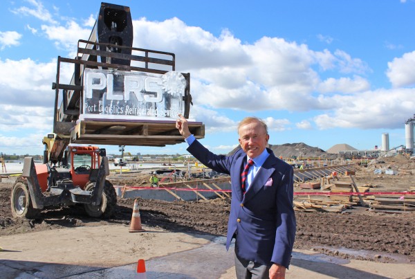 Investor Richard Corbett points at a block of ice sculpted with the logo of Port Logistics Refrigerated Services, at the construction site of their state of the art facility, at Port Tampa Bay.