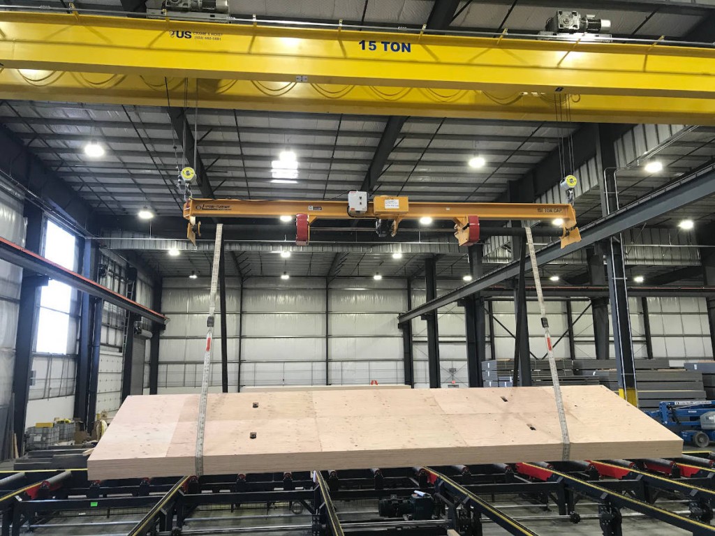 The Posi-Turner is operated beneath the hook of a 15-ton capacity overhead crane.