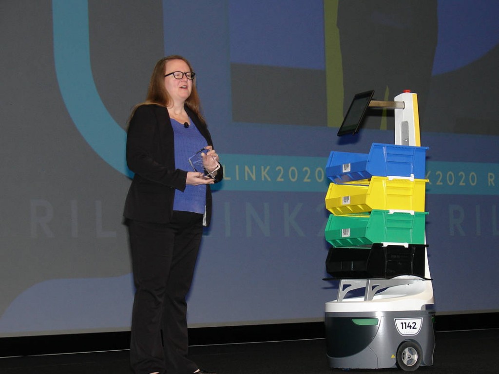Jessica Dankert, the Retail Industry Leaders Association’s vice president for supply chain, is joined by a DHL Supply Chain robot in kicking off LINK2020: The Retail Supply Chain Conference. (Photo by Paul Scott Abbott, AJOT)