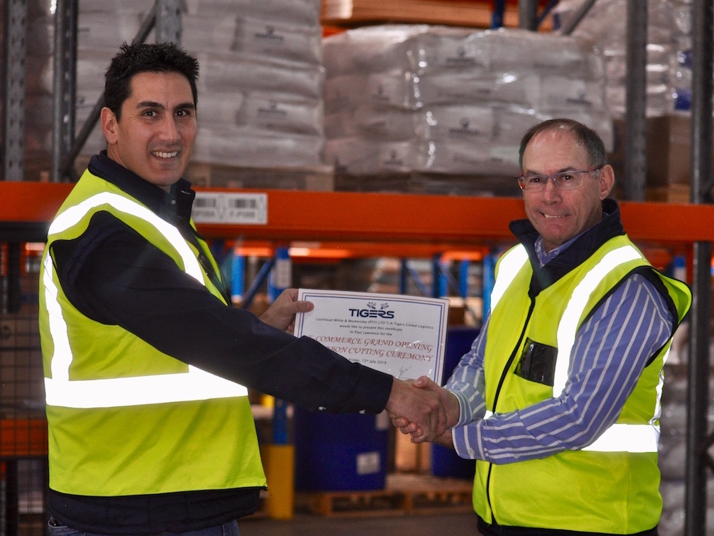 Paul Lawrence, Managing Director, Tigers (right), shaking hands with Ewald Fernandes, General Manager – Logistics, Tigers (left), to commemorate the official opening of the new e-commerce facility at Tigers South Africa.