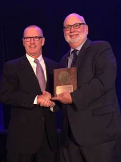 Mike Noone, President of TOTE Maritime Alaska, accepting the Top Ocean Carrier award