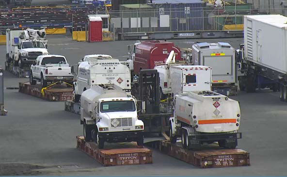 Utility trucks and generators are offloaded from TOTE’s Perla del Caribe on Oct. 7 in San Juan