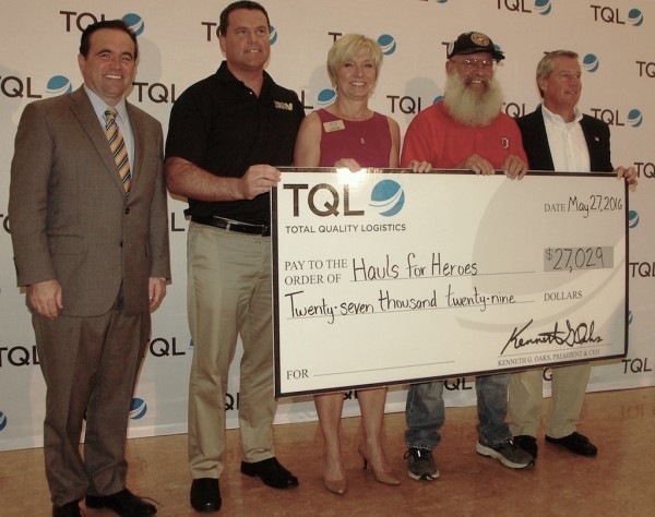 Cincinnati Mayor John Cranley, left, and Total Quality Logistics president Kerry Byrne, right, present a check for $27,029 to representatives from Disabled American Veterans, the USO and the Yellow Ribbon Support Center May 27 at the conclusion of TQL’s 2016 Hauls For Heroes Campaign.