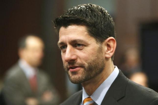 U.S. House Ways and Means Committee Chairman Paul Ryan (R-WI) (R) arrives to hold a committtee hearing on the topic of U.S. economic growth at the U.S. Capitol in Washington January 13, 2015. 