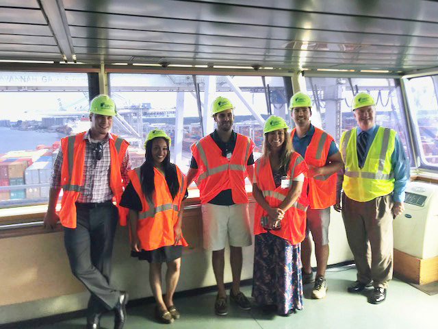 UWL Supply Chain Award winners stand with their tour guides aboard the MSC Lucy. From left to right: Celestino