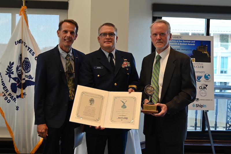 Capt. Cole Cosgrove, vice president, Crowley global ship management, was presented with the Benkert Award by U.S. Coast Guard leaders with Crowley's Owen Clarke, director, government affairs.