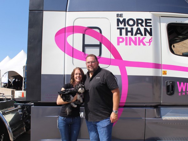 Werner professional driver Shannon Palmer and her service dog, Lily, receive the company’s second Susan G. Komen Race for the Cure truck, presented by Werner President and CEO Derek Leathers.
